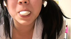 Exotic woman plays with gum and shows off her amazing cleavage