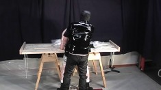 Butch Dude Endures Some Rough Plastic Punishment From Latex Master